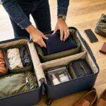 How to Pack for Any Trip: A Practical Packing System That Prevents Overpacking 10 Man packing a suitcase with packing cubes for organized travel
