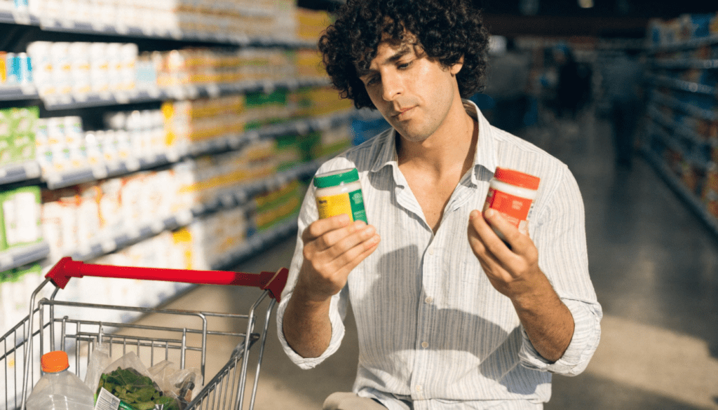 How to Save Money on Everyday Expenses: Simple Strategies That Actually Work 2 Person comparing prices before making an everyday purchase